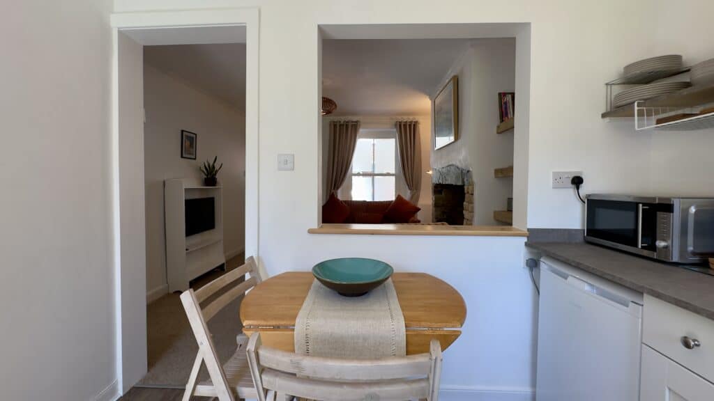 Kitchen dining area at Crofts Cottage with table and seating