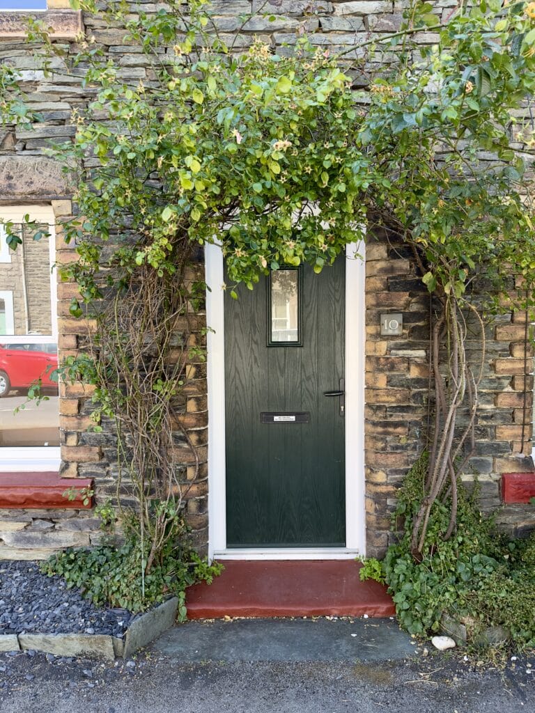 Stone-fronted entrance to Crofts Cottage on Church Street in Keswick