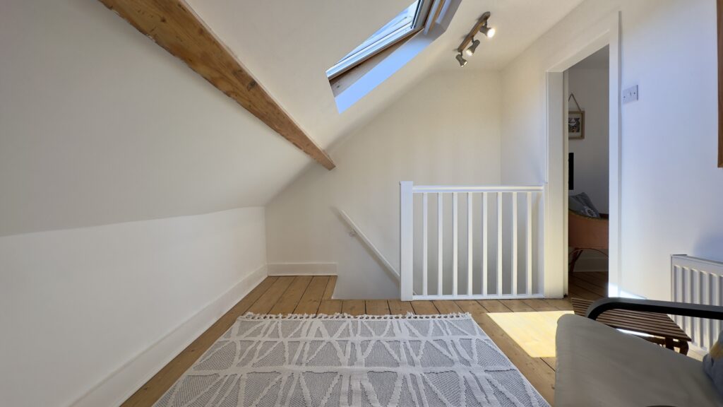 Top-floor landing and skylight at Crofts Cottage in Keswick